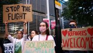 Protestors demonstrate outside the Home Office against the British Government's plans to deport asylum seekers to Rwanda, in London, Britain, June 13, 2022. Reuters/Henry Nicholls