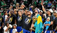 Golden State Warriors guard Stephen Curry (30) celebrates with the MVP trophy after the Golden State Warriors beat the Boston Celtics in game six of the 2022 NBA Finals to win the NBA Championship at TD Garden. Kyle Terada-USA TODAY Sports