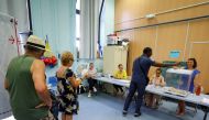 Voters stand in a voting booth to vote in the second round of the French parliamentary elections, at a polling station in Marseille, France, June 19 2022. Reuters/Eric Gaillard