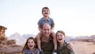 A handout photo of Britain's Prince William with Princess Charlotte, Prince Louis and Prince George taken in Jordan in the Autumn of 2021. Reuters
