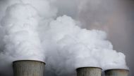 Steam rises from the cooling towers of the coal power plant of RWE, one of Europe's biggest electricity and gas companies in Niederaussem, Germany. Reuters/Wolfgang Rattay/File Photo