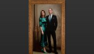 A new portrait of Britain's Prince William and Catherine, Duke and Duchess of Cambridge, painted by British portrait artist Jamie Coreth, is seen in this handout photograph released on June 23, 2022. Jamie Coreth/Fine Art Commissions