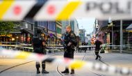 Security forces stand at the site where several people were injured during a shooting outside the London pub in central Oslo, Norway June 25, 2022. Javad Parsa/NTB/via Reuters
