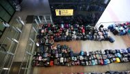 Lines of passenger luggage lie arranged outside Terminal 2 at Heathrow Airport in London, Britain, June 19, 2022. REUTERS/Henry Nicholls/File Photo