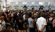 Passengers queue at check-in desks at Malaga-Costa del Sol Airport, in Malaga, Spain June 4, 2022. Reuters/Jon Nazca

