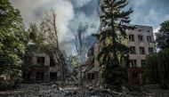 Smoke rises over the remains of a building destroyed by a military strike, as Russia's attack on Ukraine continues, in Lysychansk, Luhansk region, Ukraine June 17, 2022. REUTERS/Oleksandr Ratushniak/File Photo

