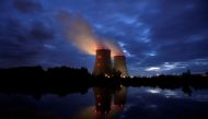FILE PHOTO: Steam rises from cooling towers of the Electricite de France (EDF) nuclear power plant in Belleville-sur-Loire, France October 12, 2021. REUTERS/Benoit Tessier/File Photo