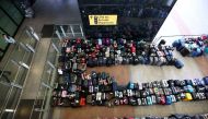Lines of passenger luggage lie arranged outside Terminal 2 at Heathrow Airport in London, Britain, June 19, 2022. REUTERS/Henry Nicholls/File Photo/File Photo