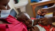A nurse administers the malaria vaccine to an infant at the Lumumba Sub-County hospital in Kisumu, Kenya, July 1, 2022. REUTERS/Baz Ratner