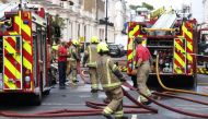 Firefighters attend a fire in Eaton Place, in London, Britain July 14, 2022. (REUTERS/Tom Nicholson)