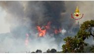 Firefighters battle wildfires in Duino, near Trieste, Italy, July 20, 2022, in this screengrab taken from a video. Vigili del Fuoco/Handout via REUTERS