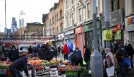 People shop at a market stalls in east London, Britain, January 23, 2021. REUTERS/Henry Nicholls