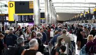 Passengers queue inside the departures terminal of Terminal 2 at Heathrow Airport in London, Britain, June 27, 2022. REUTERS/Henry Nicholls/File Photo


