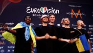 Kalush Orchestra from Ukraine pose for photographers after winning the 2022 Eurovision Song Contest, in Turin, Italy, May 15, 2022. REUTERS/Yara Nardi