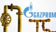 Model of natural gas pipeline and Gazprom logo, July 18, 2022. (REUTERS/Dado Ruvic/Illustration)