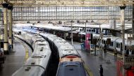 A view of trains on the platform at Waterloo Station as a station worker stands nearby, on the first day of national rail strike in London, Britain, June 21, 2022. REUTERS/Henry Nicholls

