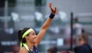 France's Caroline Garcia celebrates winning the women's singles final against Romania's Ana Bogdan at the Legia Tennis Stadium, Warsaw, Poland, July 31, 2022. (REUTERS/Kacper Pempel)