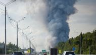 Smoke rises above Ozon e-commerce firm's warehouse in Istrinsky District of the Moscow region, Russia August 3, 2022. REUTERS/Maxim Shemetov