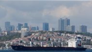 The Sierra Leone-flagged cargo ship Razoni, carrying Ukrainian grain, sails in the Bosphorus en route to Lebanon, in Istanbul, Turkey August 3, 2022. (REUTERS/Dilara Senkaya)