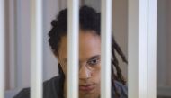 US basketball player Brittney Griner sits inside a defendants' cage during the reading of the court's verdict in Khimki outside Moscow, Russia, August 4, 2022. (REUTERS/Evgenia Novozhenina/Pool)
