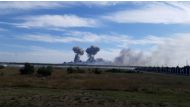 File photo: Smoke rises after explosions were heard from the direction of a Russian military airbase near Novofedorivka, Crimea, in this still image obtained by Reuters August 9, 2022. 