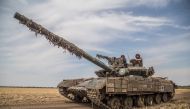 Ukrainian servicemen ride atop a tank near a front line in Mykolaiv region, as Russia's attack on Ukraine continues, Ukraine, August 10, 2022. (REUTERS/Oleksandr Ratushniak)