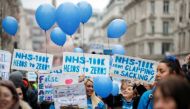 NHS staff march in a protest against the coronavirus disease (COVID-19) vaccine rules, in London, Britain, January 22, 2022. REUTERS/Peter Nicholls 