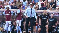 Aston Villa manager Steven Gerrard reacts as Ashley Young and Ezri Konsa look on. (REUTERS/Dylan Martinez)