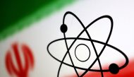 The atomic symbol and the Iranian flag are seen in this illustration, July 21, 2022. REUTERS/Dado Ruvic/Illustration//File Photo
 