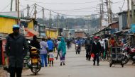 A general view shows people walking along the main street following announcement of the results of Kenya's presidential election, in Silanga village, Kibera slums of Nairobi, Kenya August 16, 2022. Reuters/Thomas Mukoya