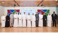 Silatech and UDST officials pose during the collaboration agreement signing ceremony.