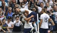Tottenham Hotspur's Harry Kane celebrates scoring their first goal with Ivan Perisic and Eric Dier REUTERS/Tony Obrien