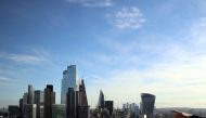A person points to the City of London financial district from a viewing platform in London, Britain, on October 22, 2021. File Photo/ Reuters
