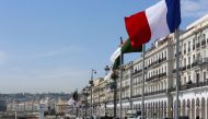 Algerian and French flags flutter ahead of the arrival of French President Emmanuel Macron, in Algiers, Algeria, on August 25, 2022. REUTERS/Ramzi Boudina