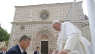 Pope Francis visits the Basilica of Santa Maria di Collemaggio in L'Aquila, Italy, on August 28, 2022. Vatican Media/­Handout via REUTERS 