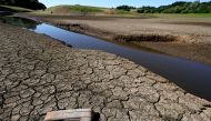 Cracks can be seen in the dried up bed of Tittesworth Reservoir, in Leek, Britain, on August 12, 2022. REUTERS/Carl Recine/File Photo