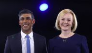 Conservative leadership candidates Liz Truss and Rishi Sunak stand together as they attend a hustings event, part of the Conservative party leadership campaign, in London, on August 31, 2022. REUTERS/Hannah McKay/File Photo