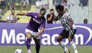 Juventus' Juan Cuadrado in action with Fiorentina's Riccardo Sottil REUTERS/Ciro De Luca
