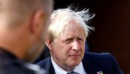 British Prime Minister Boris Johnson looks on during a visit with members of the Thames Valley Police, at Milton Keynes Police Station in Milton Keynes on August 31, 2022. REUTERS/Andrew Boyers/Pool/File Photo