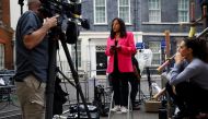 Members of the media work outside 10 Downing Street after Liz Truss was announced as Britain's next Prime Minister, in London, on September 5, 2022. REUTERS/Hannah McKay