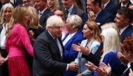 Outgoing British Prime Minister Boris Johnson, with his wife Carrie Johnson, greets people after delivering a speech on his last day in office, outside Downing Street, in London, Britain September 6, 2022. Reuters/Henry Nicholls
