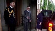 Newly elected leader of the Conservative party Liz Truss is greeted by Britain's Queen Elizabeth's Equerry Lieutenant Colonel Tom White and her Private Secretary Sir Edward Young as she arrives for an audience with Queen Elizabeth, at Balmoral Castle, Scotland, on September 6, 2022.  Andrew Milligan/Pool via REUTERS