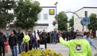 People queue to vote at a polling station for early voting in the suburb of Rinkeby, Stockholm, on September 10, 2022. TT News Agency/Ali Lorestani via REUTERS
