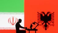 Figurines with computers are seen in front of Albanian and Iran flags in this illustration taken on September 10, 2022. REUTERS/Dado Ruvic/Illustration
