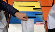 A person casts a ballot at a polling station in Stockholm, Sweden, September 11, 2022. Pontus Lundahl/TT News Agency/via Reuters