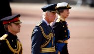 Britain's King Charles marches during a procession where the coffin of Britain's Queen Elizabeth is transported from Buckingham Palace to the Houses of Parliament for her lying in state, in London, Britain, on September 14, 2022. REUTERS/Sarah Meyssonnier