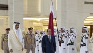 Amir H H Sheikh Tamim bin Hamad Al Thani and President of Egypt H E Abdel Fattah El Sisi inspect a guard of honour at the Amiri Diwan yesterday.
