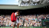 Switzerland's Roger Federer leaves Centre Court after losing his quarter final match against Poland's Hubert Hurkacz at the All England Lawn Tennis and Croquet Club in London on July 7, 2021.  File Photo / Reuters
