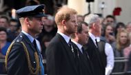 Britain's William, Prince of Wales and Prince Harry march during a procession where the coffin of Britain's Queen Elizabeth is transported from Buckingham Palace to the Houses of Parliament for her lying in state, in London, Britain, September 14, 2022. REUTERS/Clodagh Kilcoyne/File Photo


