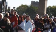 People queue on Lambeth Bridge, to pay their respects to Britain's Queen Elizabeth following her death, in London, Britain, September 17, 2022. Reuters/Tom Nicholson